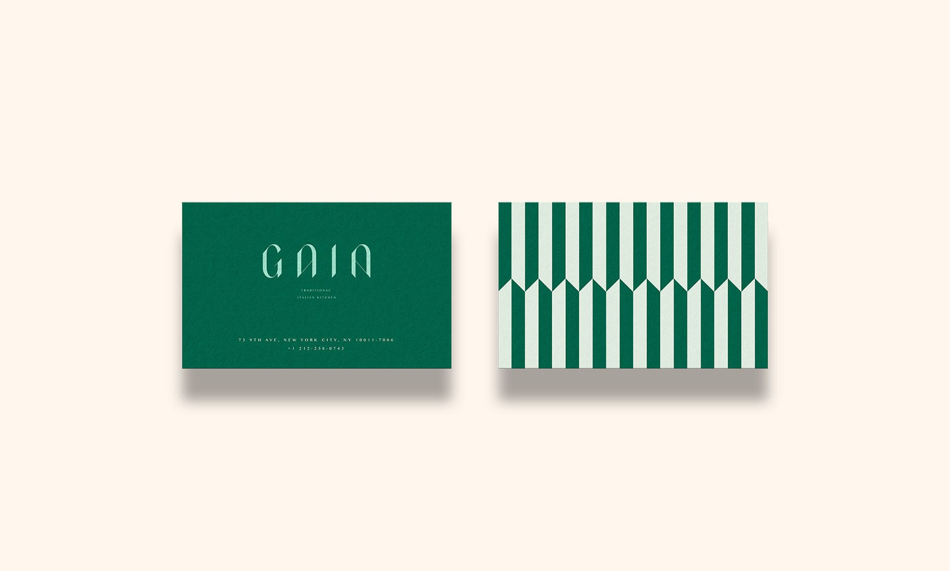 Gaia business card front and back, dark green and striped, on cream