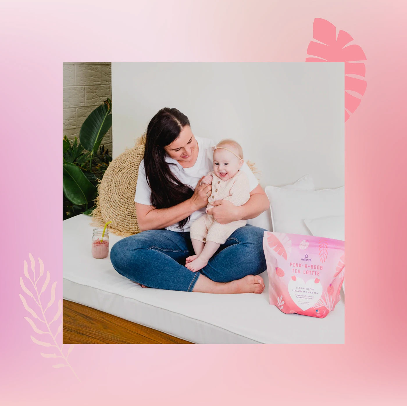 Mother and baby on a sofa beside a pink Milksta pouch