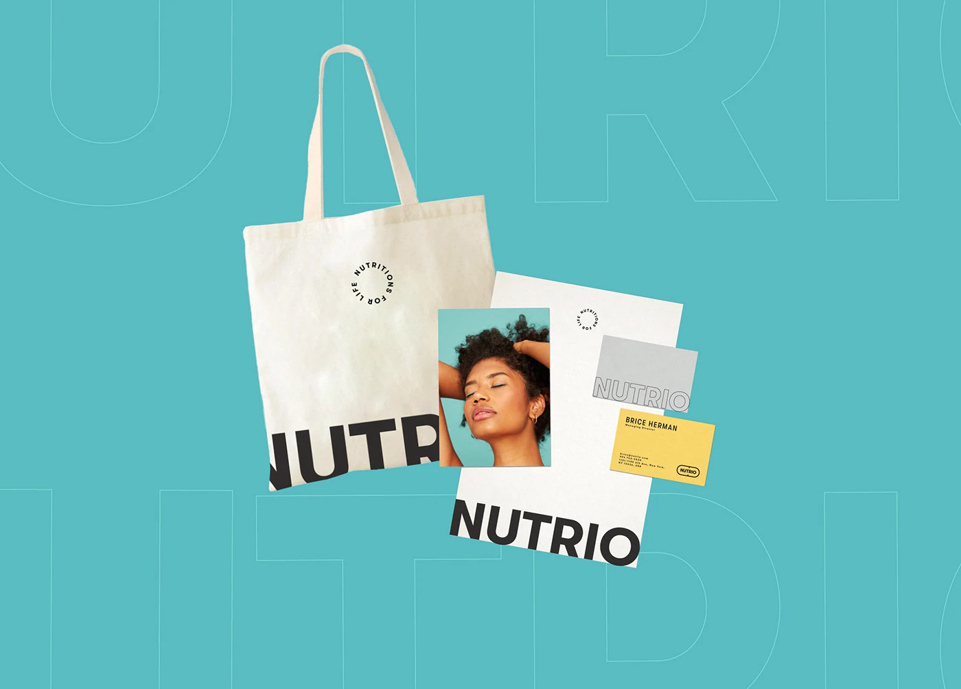 Nutrio tote, cards and a portrait print on teal with the faded wordmark
