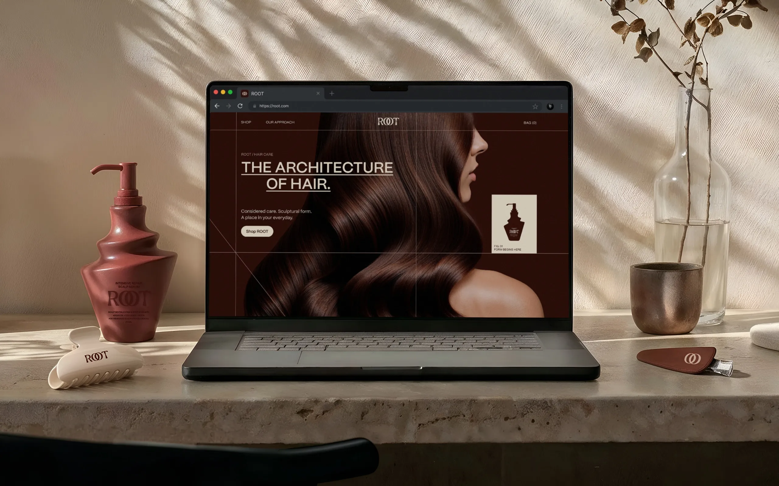 ROOT website open on a laptop next to the sculptural ROOT bottle