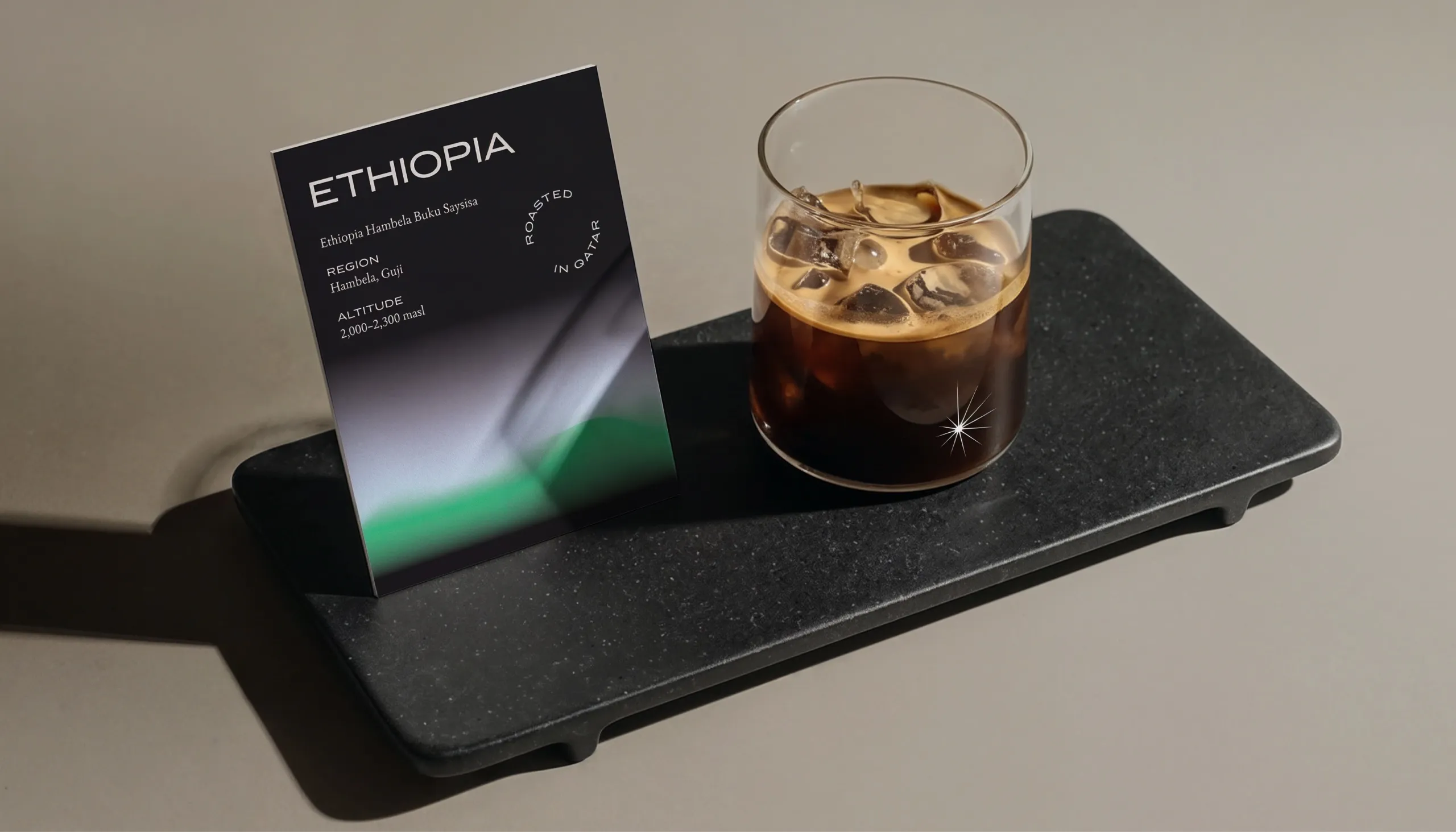 AZHA Ethiopia coffee card beside an iced coffee