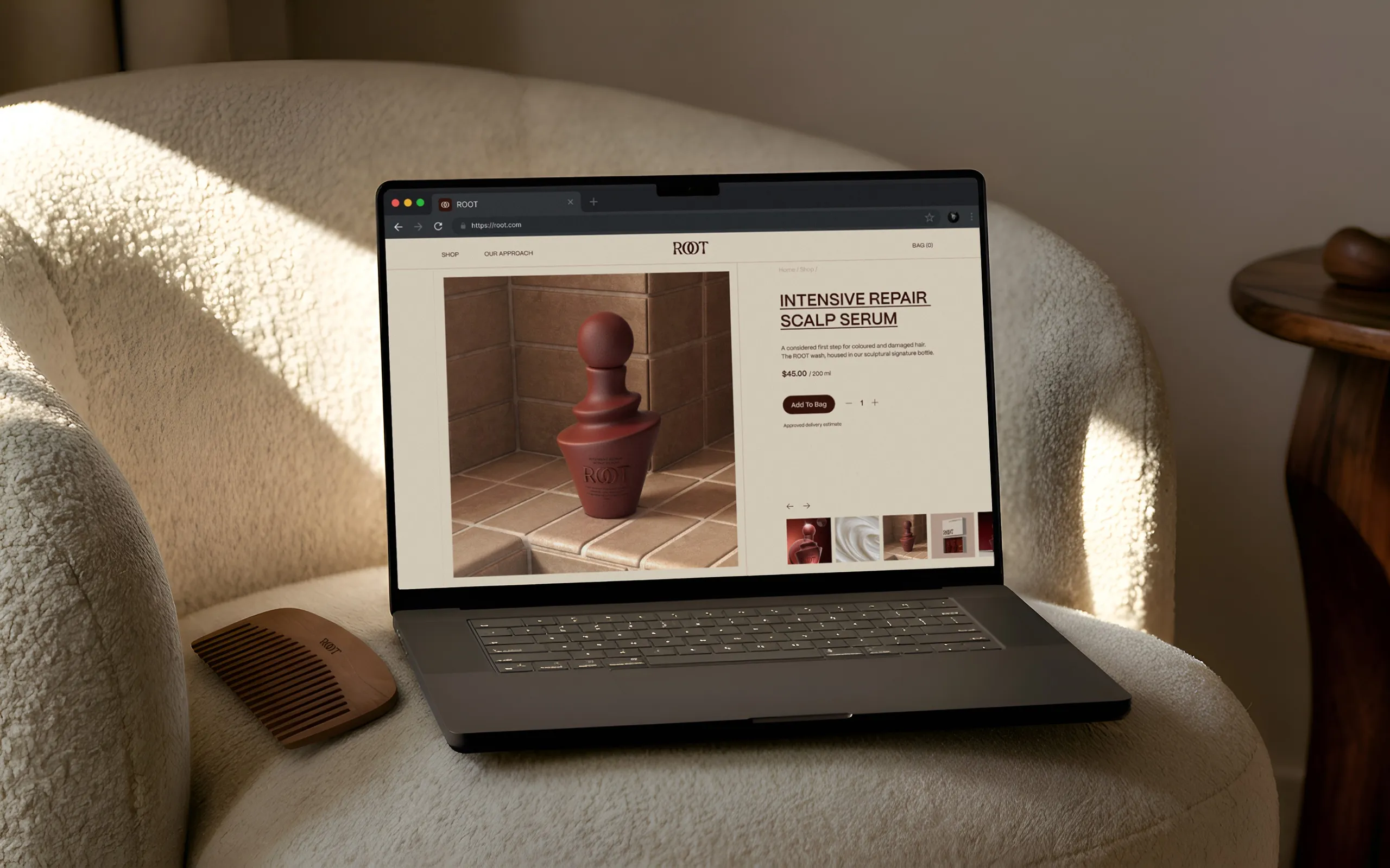 ROOT product page on a laptop resting on a boucle armchair